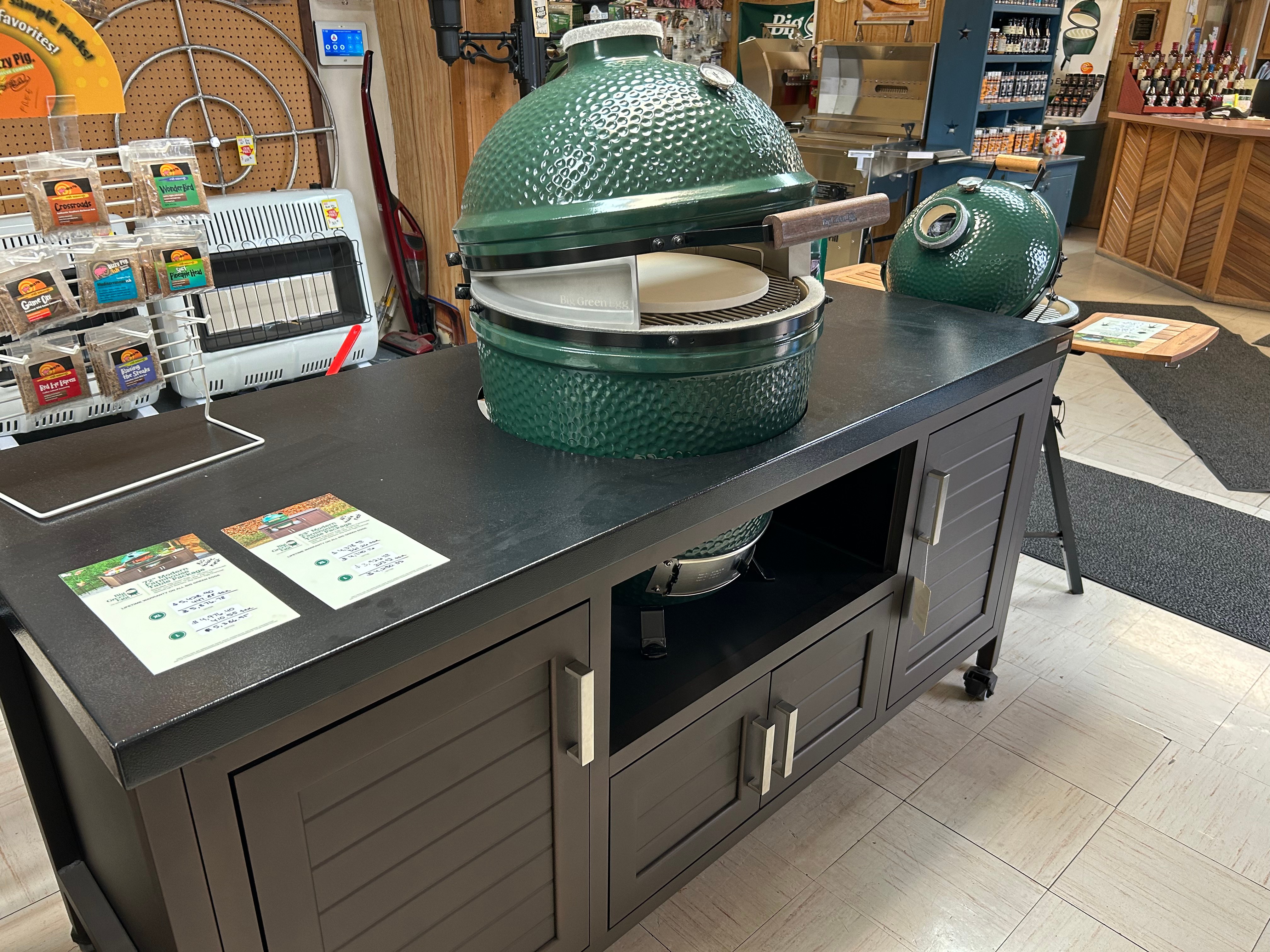 Big Green Egg showroom floor at Action Propane in Leander TX — multiple EGG sizes on display